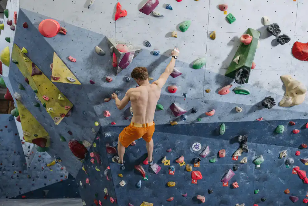 Climber tackling a challenging overhang route